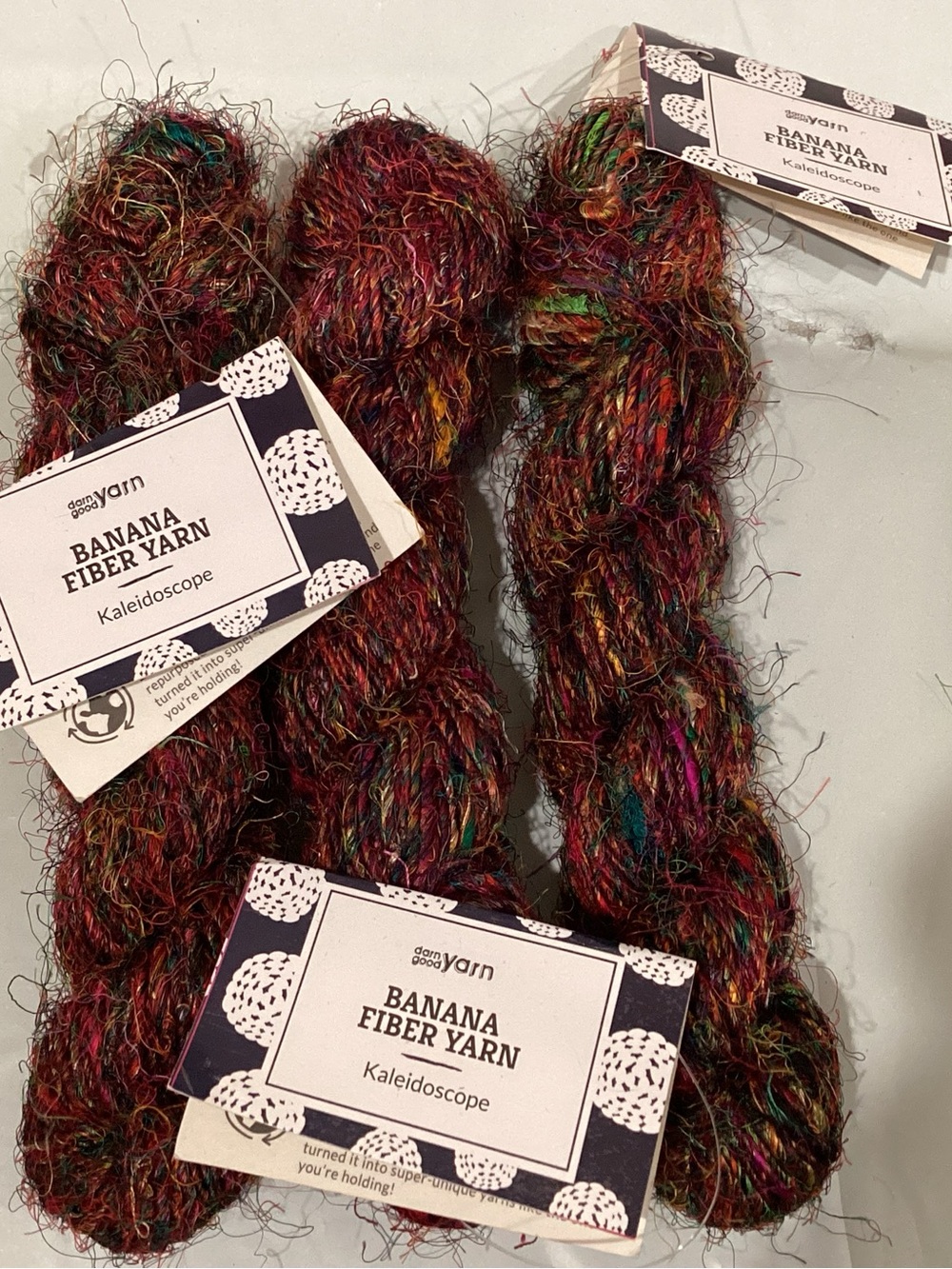 3 hanks of Darn Good Yarn banana fiber yarn in colorway kaleidoscope